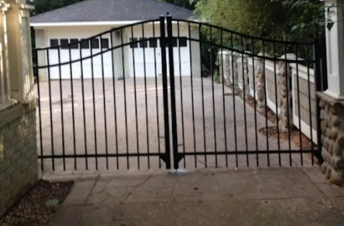Black arched driveway gate — Charlotte NC